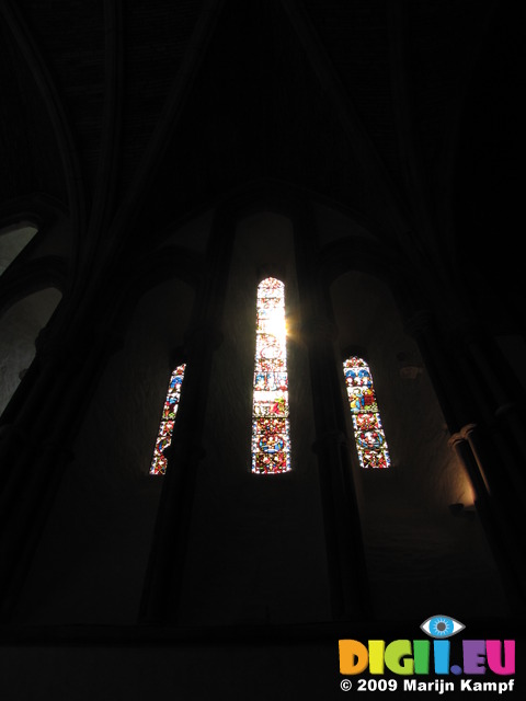 SX06010 Sun shining through stained glass window in Brecon Cathedral